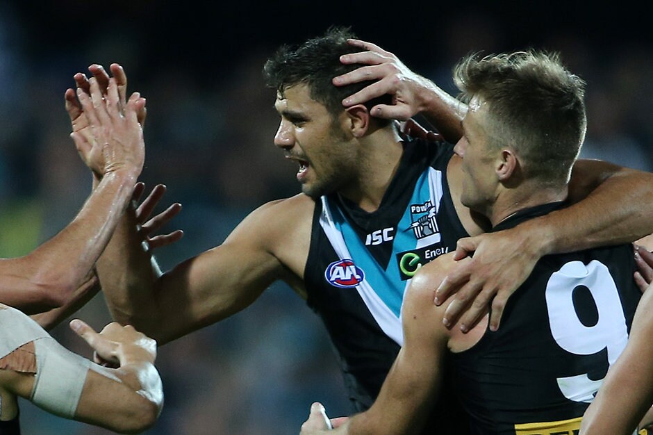 AFL 2015 Rd 02 - Port Adelaide v Sydney Patrick Ryder of the Powercelebrates his first goal for the club with Robbie Gray and team mates during the 2015 AFL Round 02 match between Port Adelaide Power and the Sydney Swans at Adelaide Oval, Adelaide on April 11, 2015. (Photo: AFL Media)